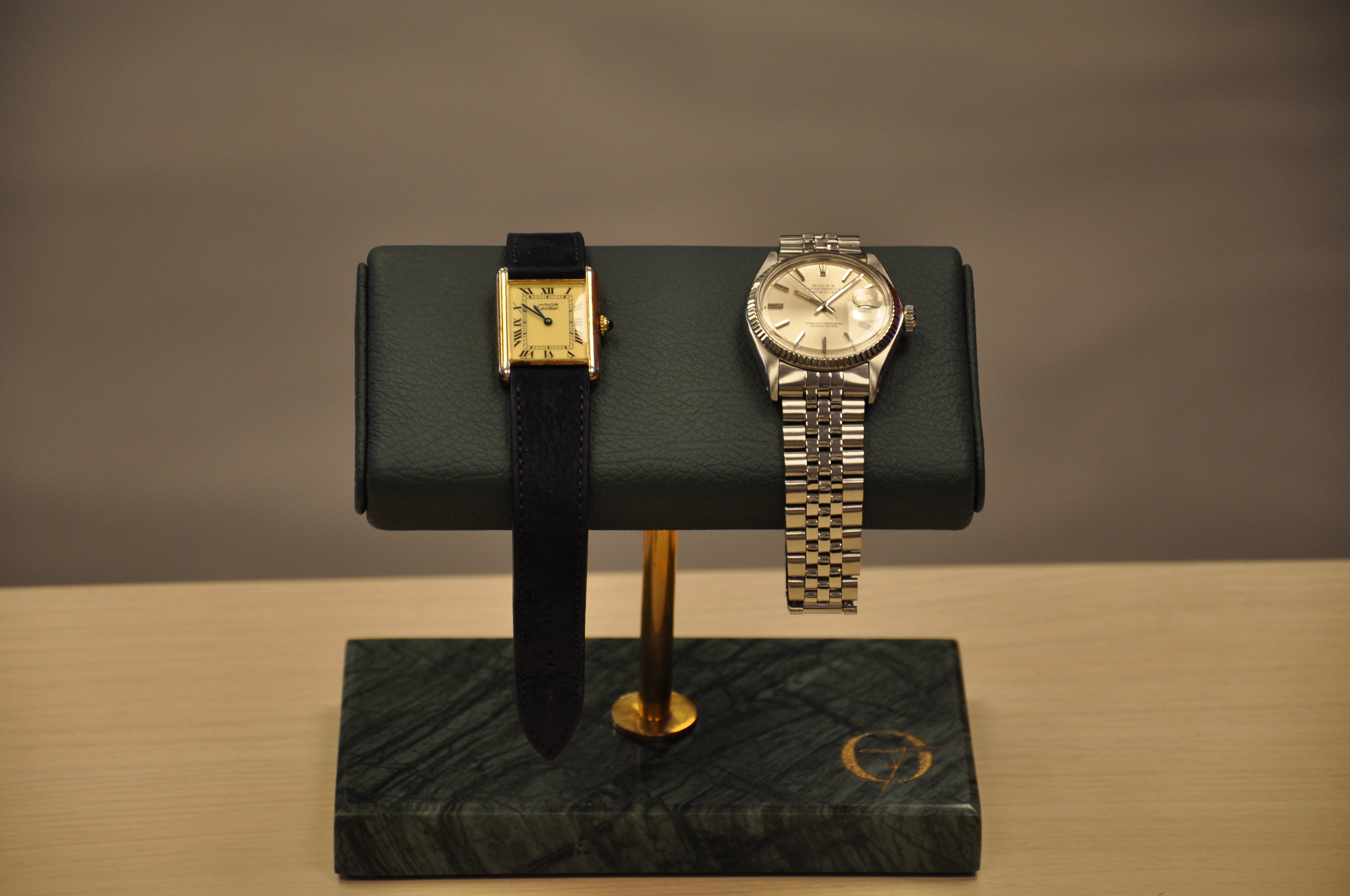 alt="Double watch stand elegantly holding two premium watches – OFL"