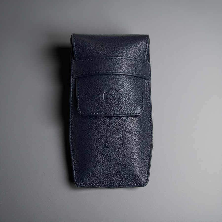 OFL handcrafted navy blue leather watch pouch, closed, front view with embossed OFL logo