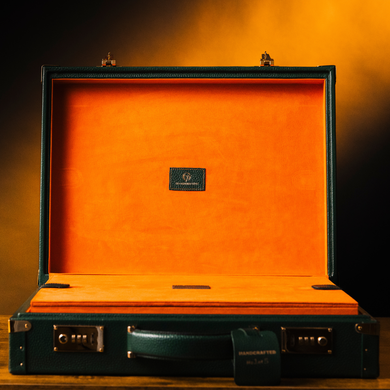 OFL Watch Case Heritage Edition, open, showing the vibrant orange suede interior and deep green leather