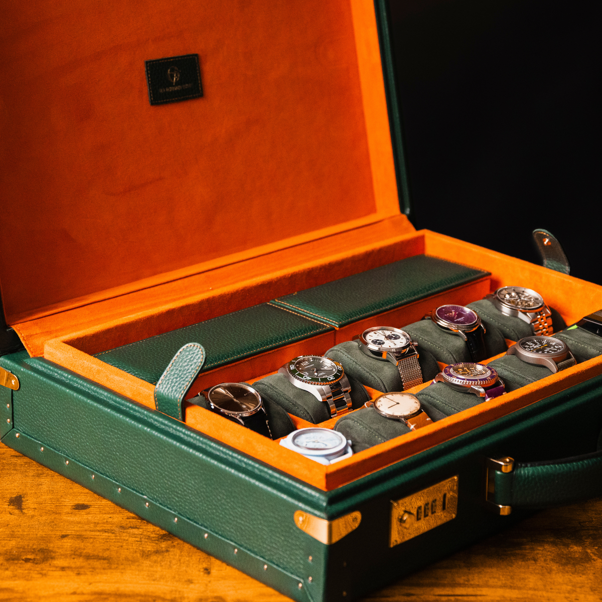 OFL Watch Case Heritage Edition, open, filled with a watch collection on orange suede cushions