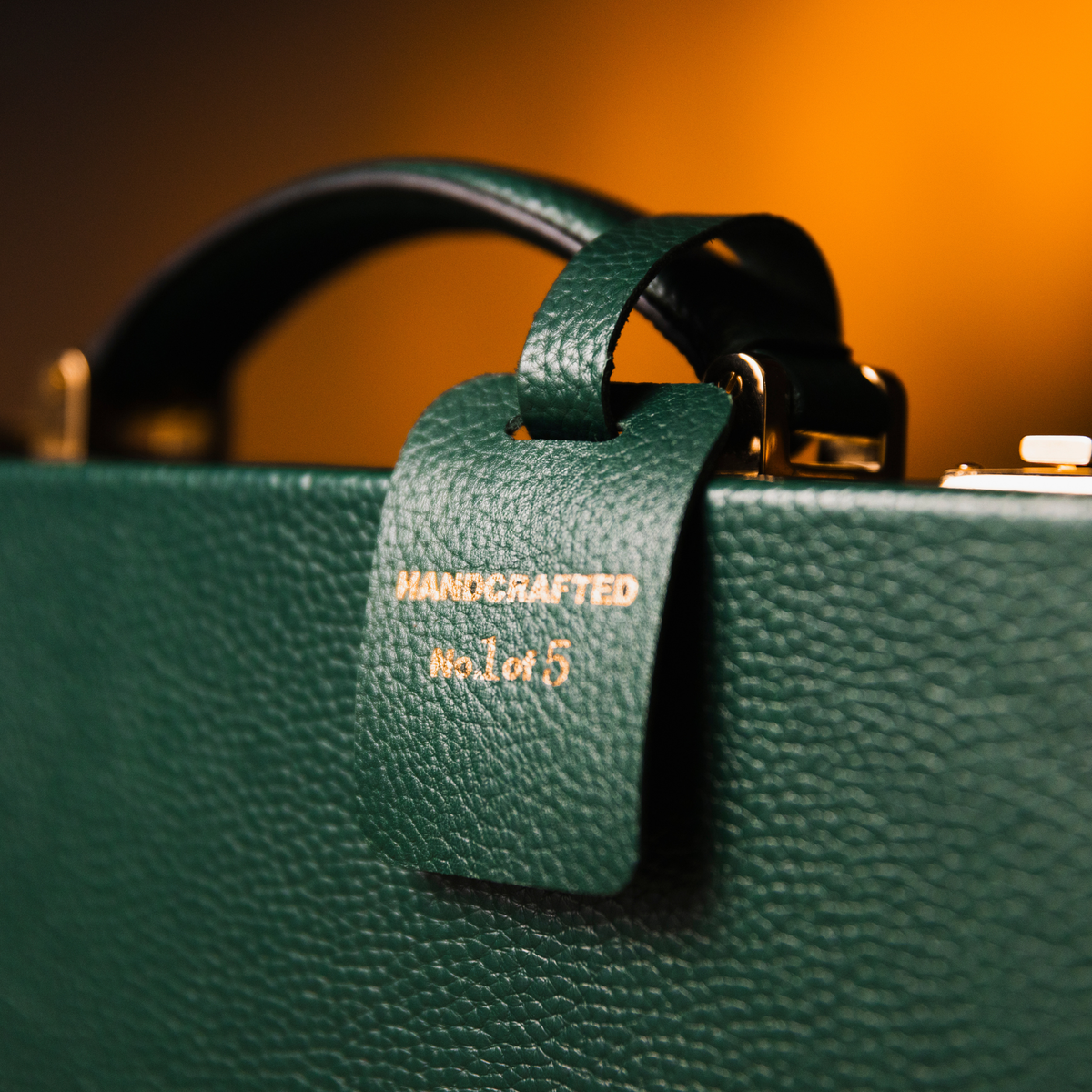 Close-up of the handle and handcrafted leather tag on the OFL Heritage Edition watch case