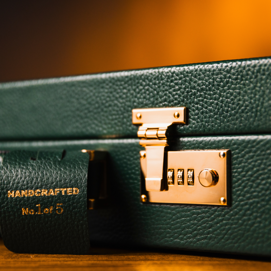 Close-up of the gold-plated combination lock and handcrafted stamp on the OFL Heritage Edition